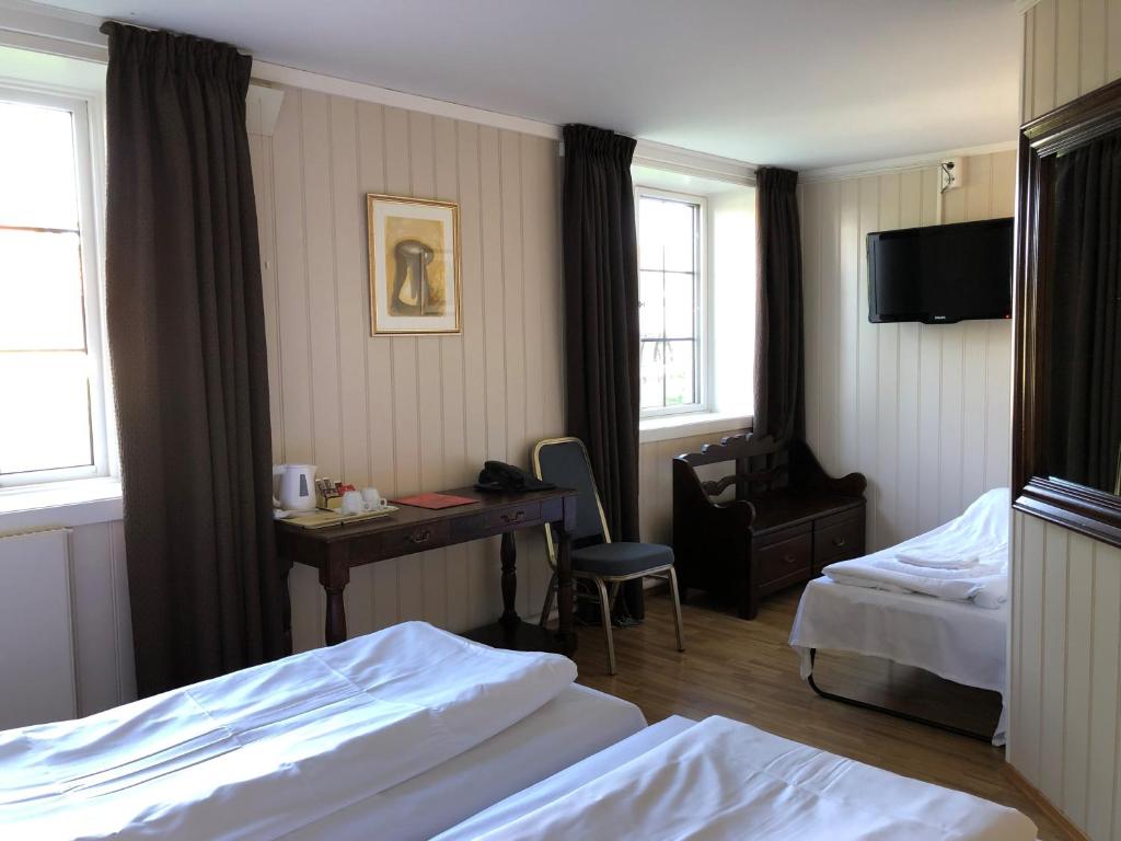 Postel nebo postele na pokoji v ubytování Klækken Hotel