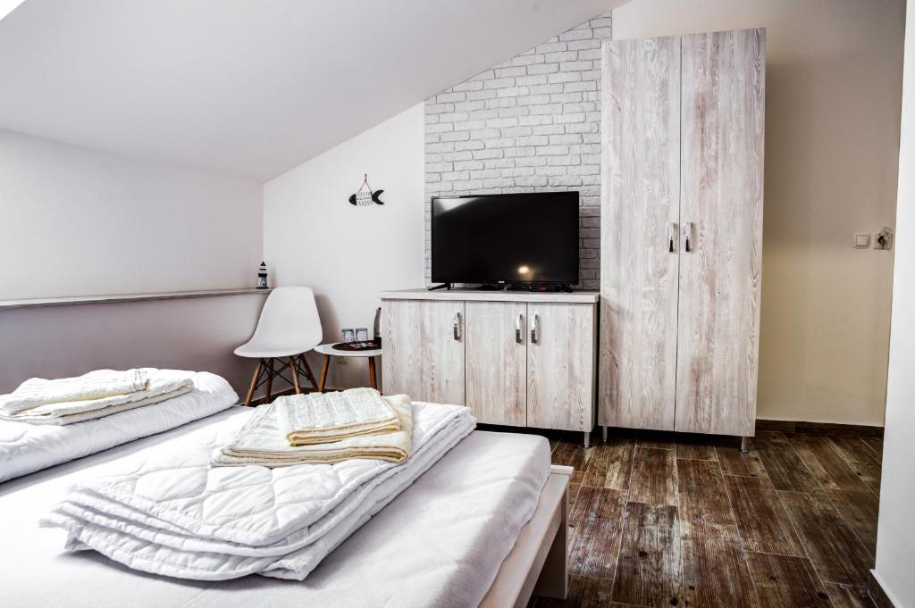 TV tai viihdekeskus majoituspaikassa Hotel Sara