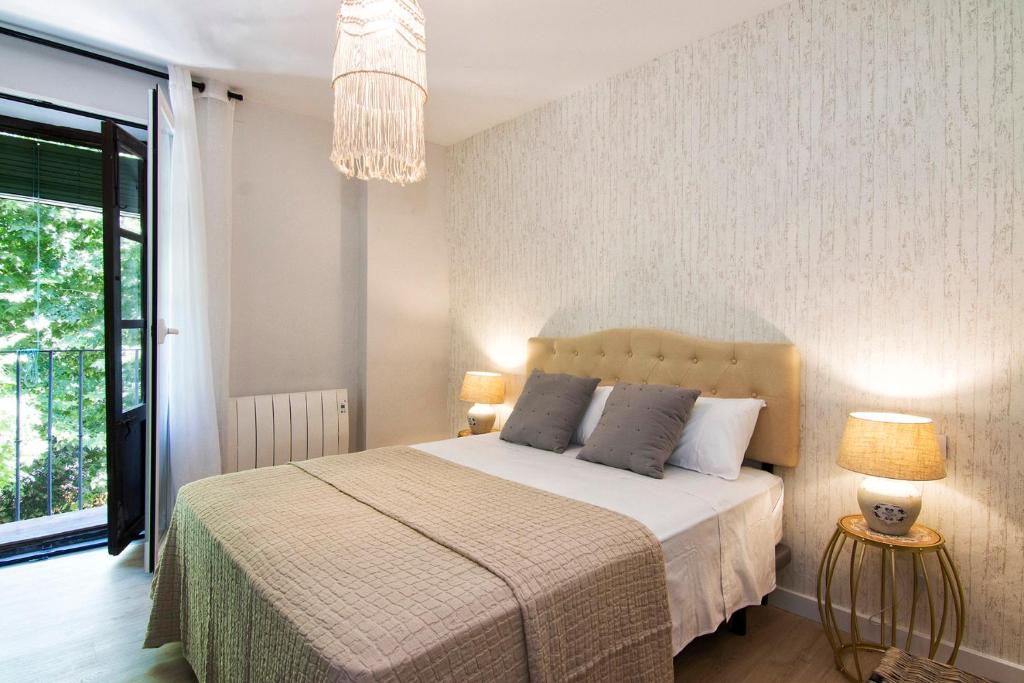 Posteľ alebo postele v izbe v ubytovaní Apartamentos Los Lobos