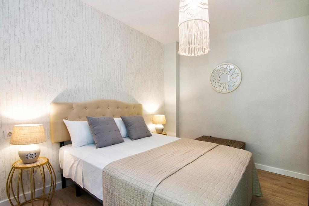 Posteľ alebo postele v izbe v ubytovaní Apartamentos Los Lobos