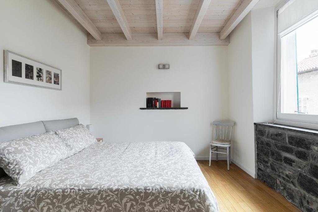 Posteľ alebo postele v izbe v ubytovaní Appartamento Rossini by Holiday Solutions