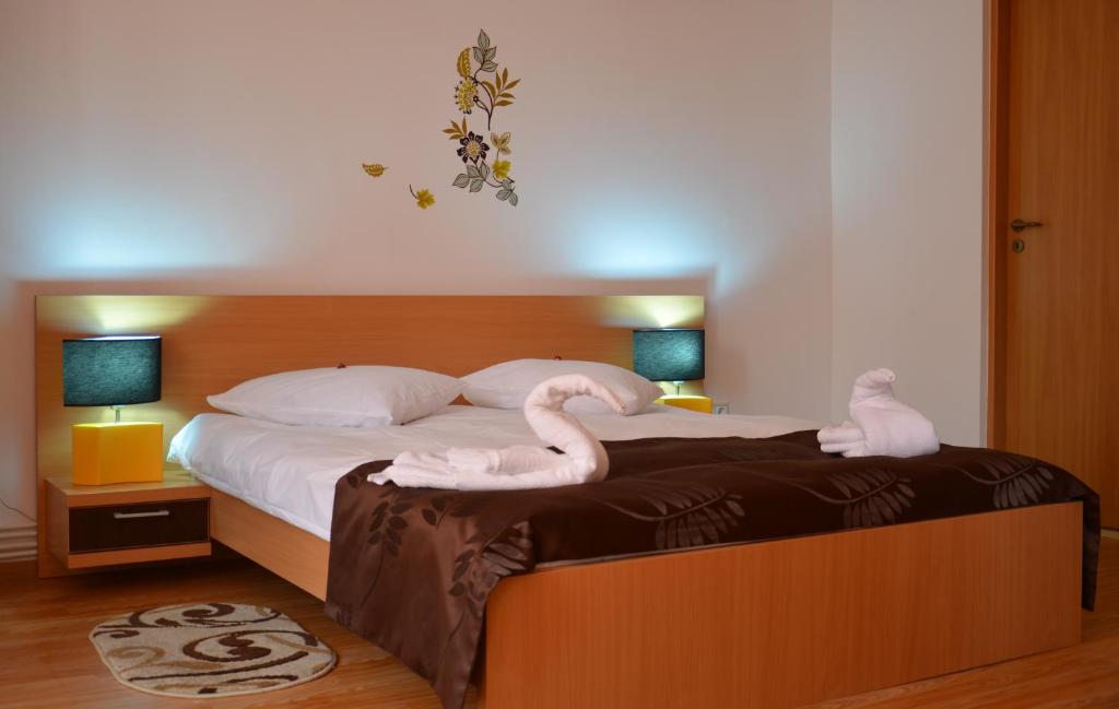 Postel nebo postele na pokoji v ubytování ApartHotel Zorilor
