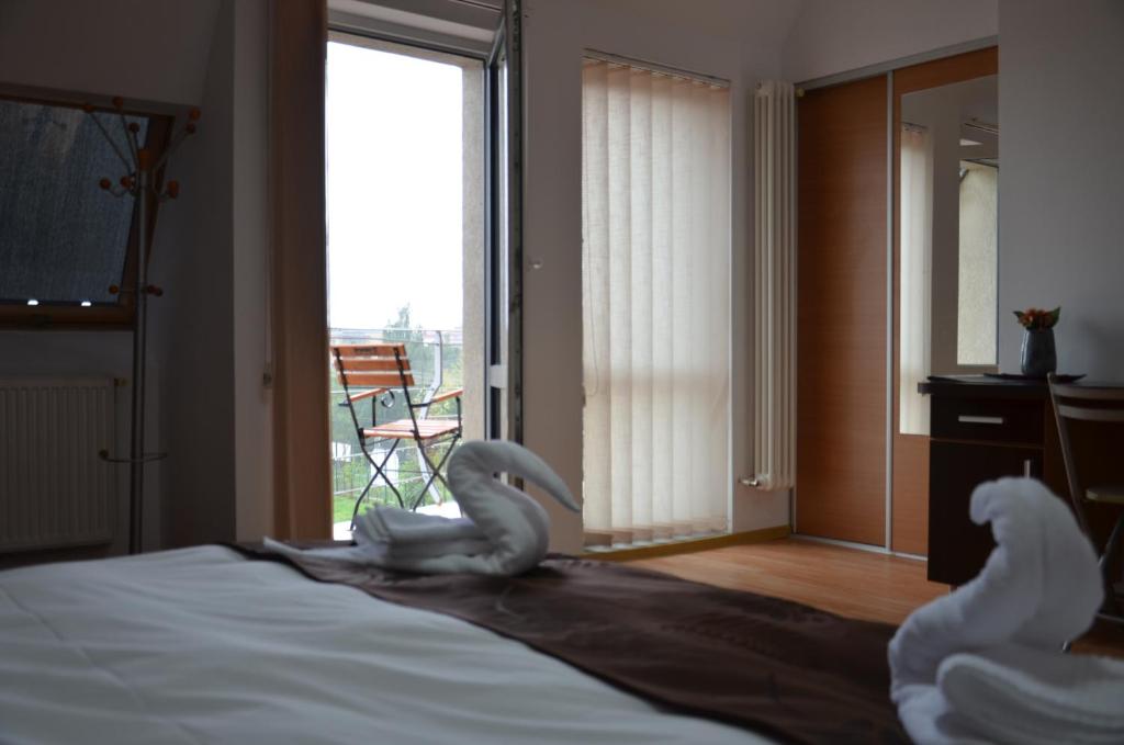 Postel nebo postele na pokoji v ubytování ApartHotel Zorilor