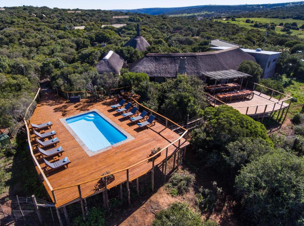 an overhead view of a house with a swimming pool on a wooden roof at Woodbury Tented Camp – Amakhala Game Reserve in Amakhala Game Reserve