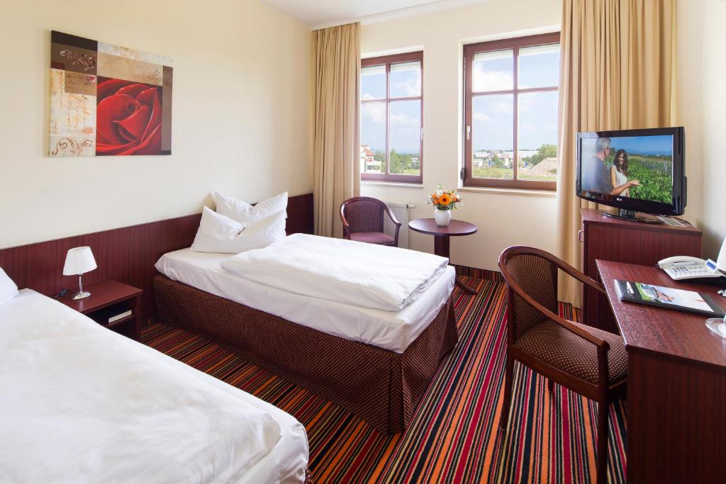 TV a/nebo společenská místnost v ubytování Kim Hotel Dresden