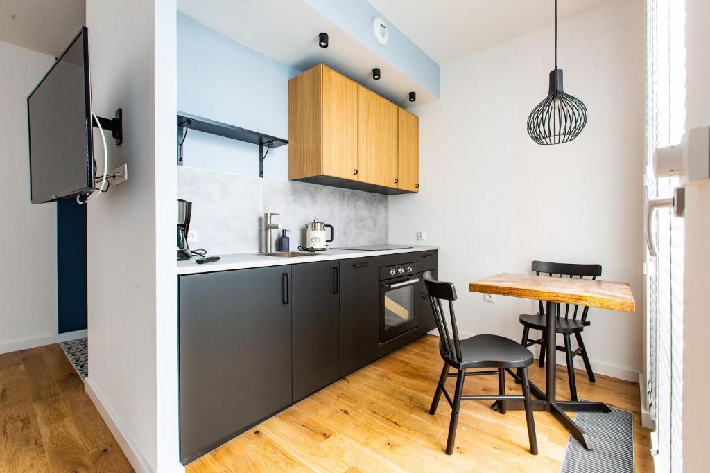 Kuchyňa alebo kuchynka v ubytovaní Gdańsk Comfort Apartament Rajska