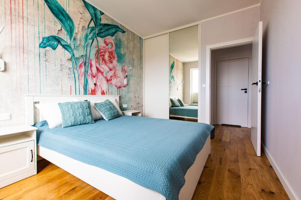 Posteľ alebo postele v izbe v ubytovaní Gdańsk Comfort Apartament Rajska