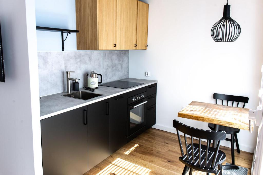 Kuchyňa alebo kuchynka v ubytovaní Gdańsk Comfort Apartament Rajska