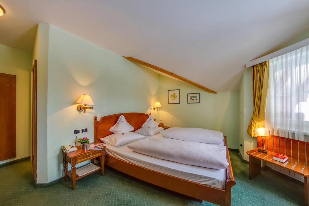 Postel nebo postele na pokoji v ubytování Hotel Berger Superior