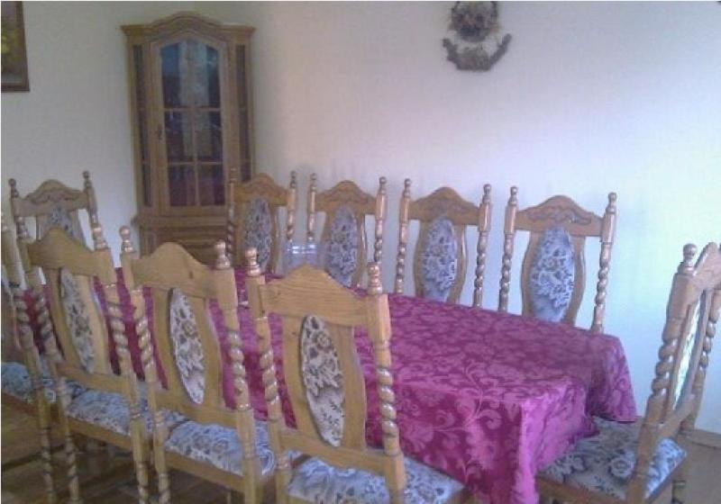 a dining room with a table with a purple table cloth at Green Country Hostel in Piaseczno