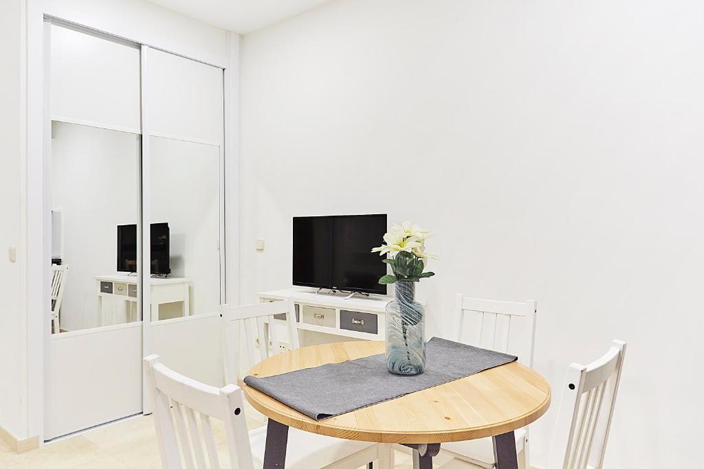 TV a/nebo společenská místnost v ubytování LEEWAYS LOFT IV in GRAN VÍA
