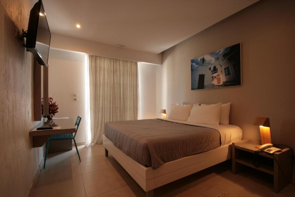 Postel nebo postele na pokoji v ubytování Irina Beach Hotel