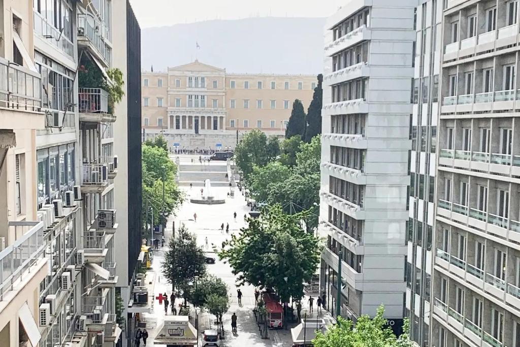 a view of a street in a city with buildings at CosmosDome. Best view in the heart of Athens! in Athens