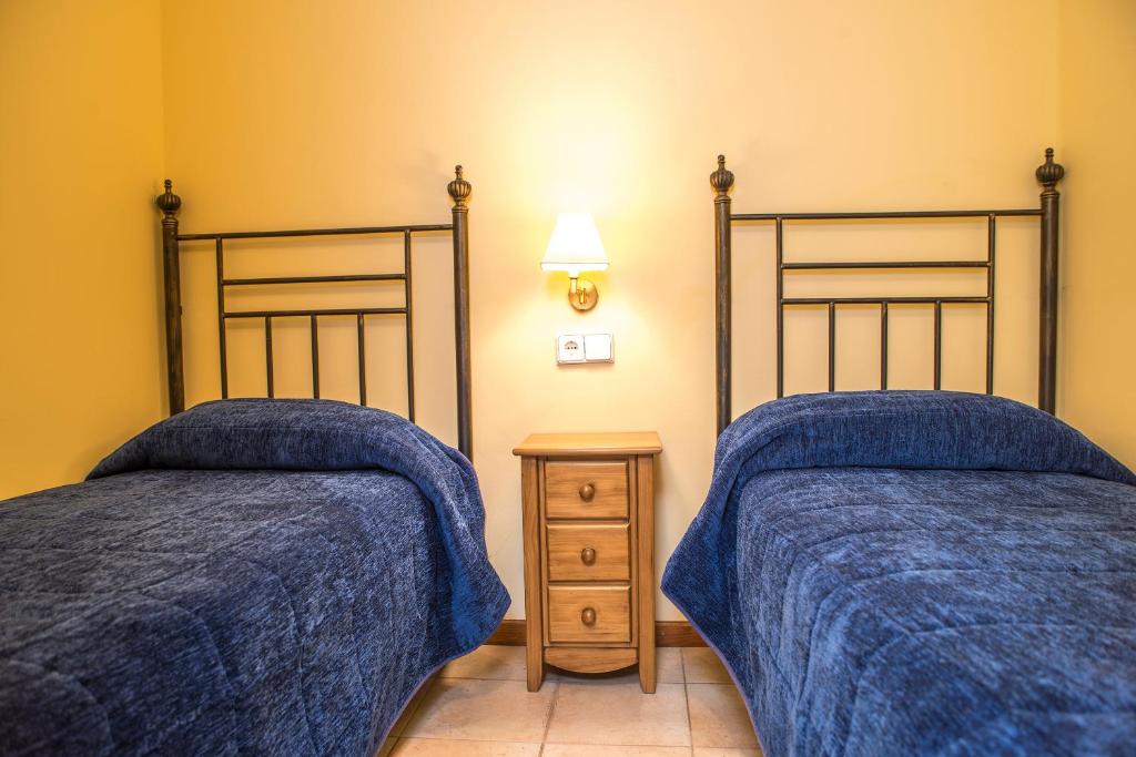 Postel nebo postele na pokoji v ubytování Aparthotel Ona el Tarter
