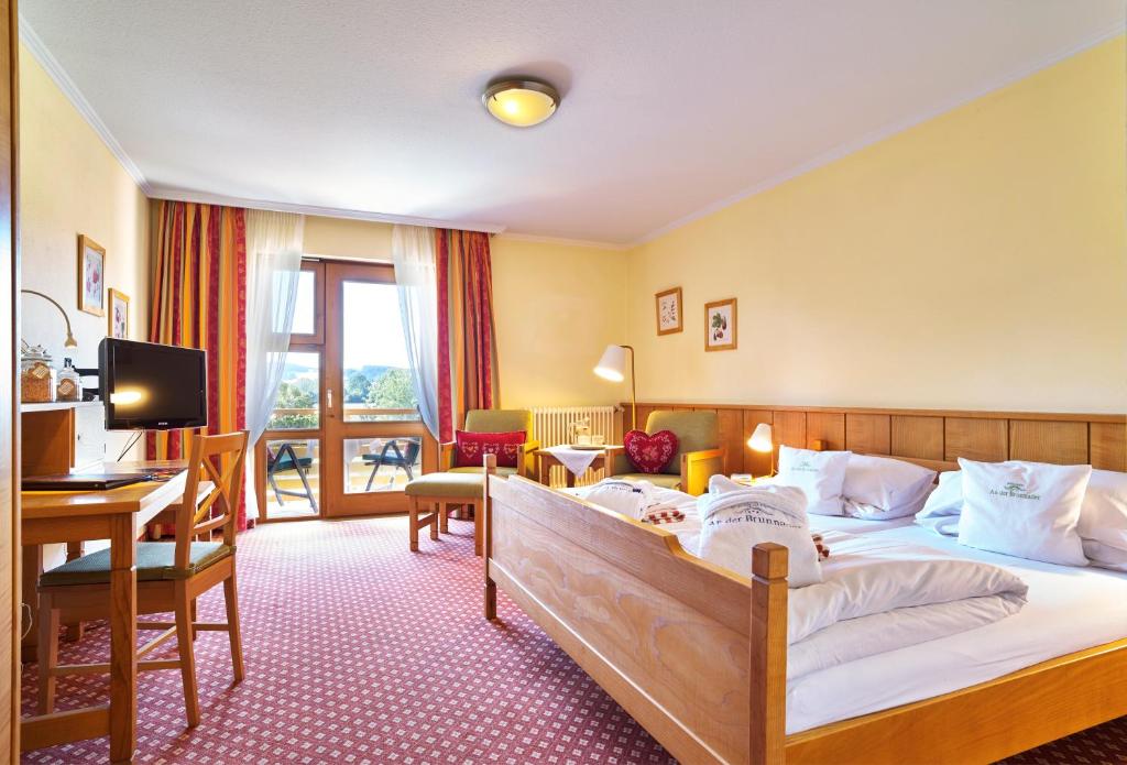 Postel nebo postele na pokoji v ubytování Hotel An der Brunnader - Die Therme befindet sich 4 Geh-Minuten entfernt