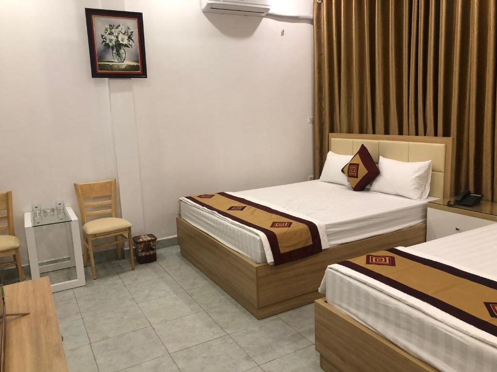 Postel nebo postele na pokoji v ubytování Nàng Hương Motel