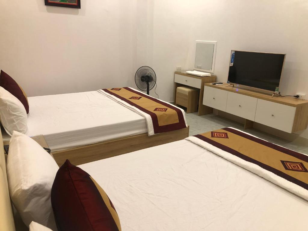 Postel nebo postele na pokoji v ubytování Nàng Hương Motel