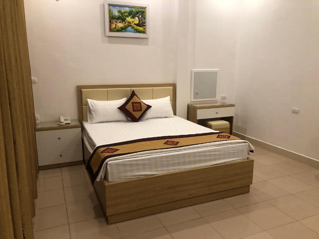 Giường trong phòng chung tại Nàng Hương Motel