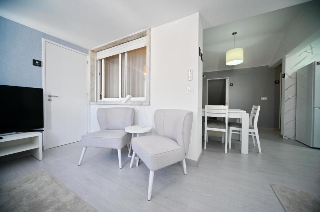 TV a/nebo společenská místnost v ubytování My Charm Lisbon Suites