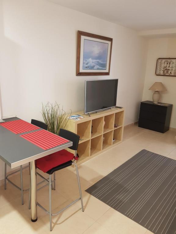 TV a/nebo společenská místnost v ubytování Apartment la Puntilla del Mar