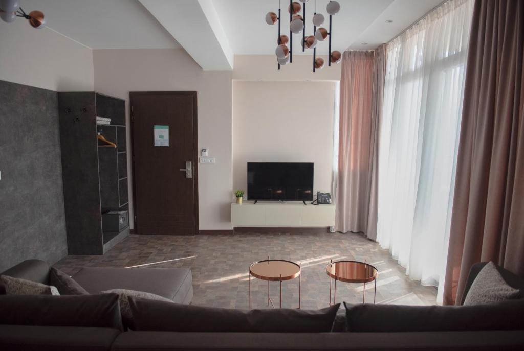 TV a/nebo společenská místnost v ubytování Hotel Premium