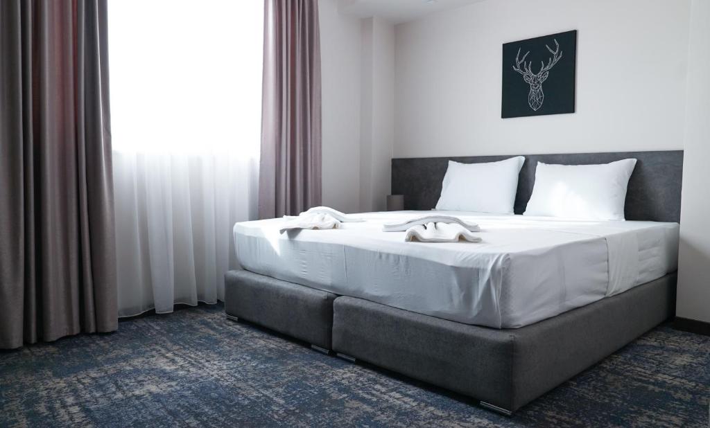 Postel nebo postele na pokoji v ubytování Hotel Premium