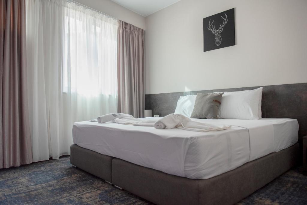 Postel nebo postele na pokoji v ubytování Hotel Premium