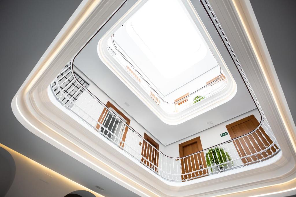 an overhead view of a building with a skylight at Plazuela del Carbón Suites in Cádiz