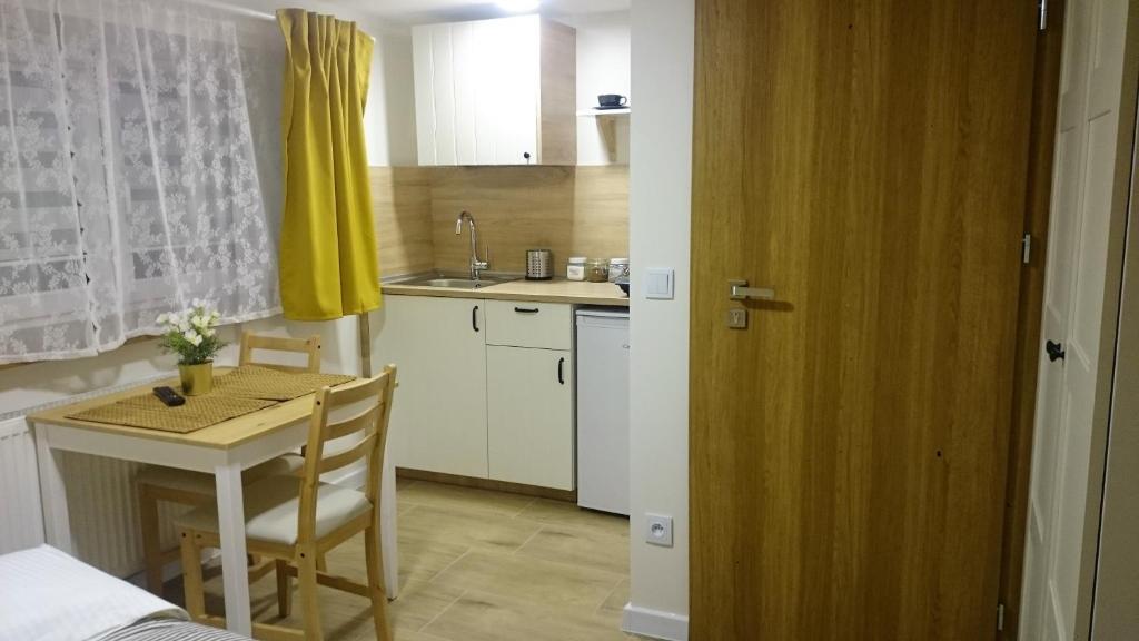 Kuchyň nebo kuchyňský kout v ubytování Apartamenty Milka