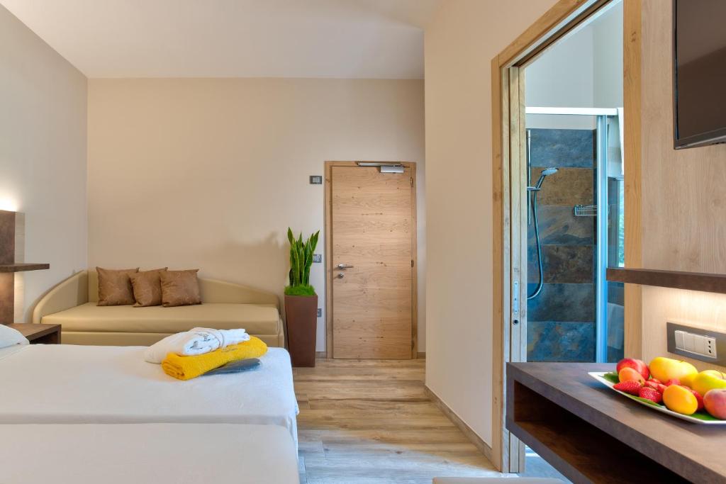 Postel nebo postele na pokoji v ubytování Hotel Aurora