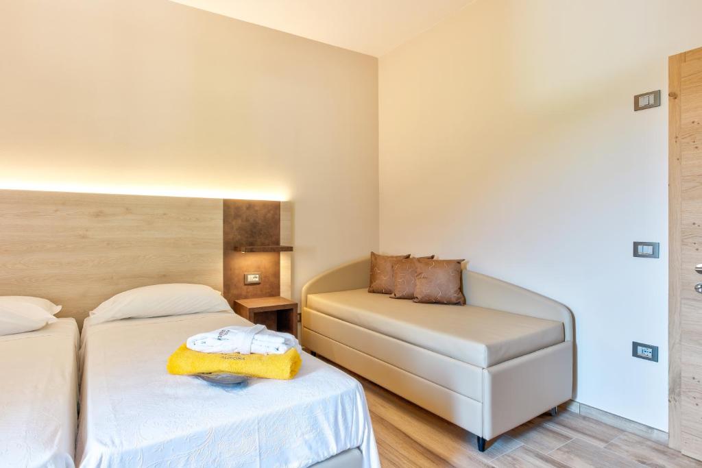 Postel nebo postele na pokoji v ubytování Hotel Aurora