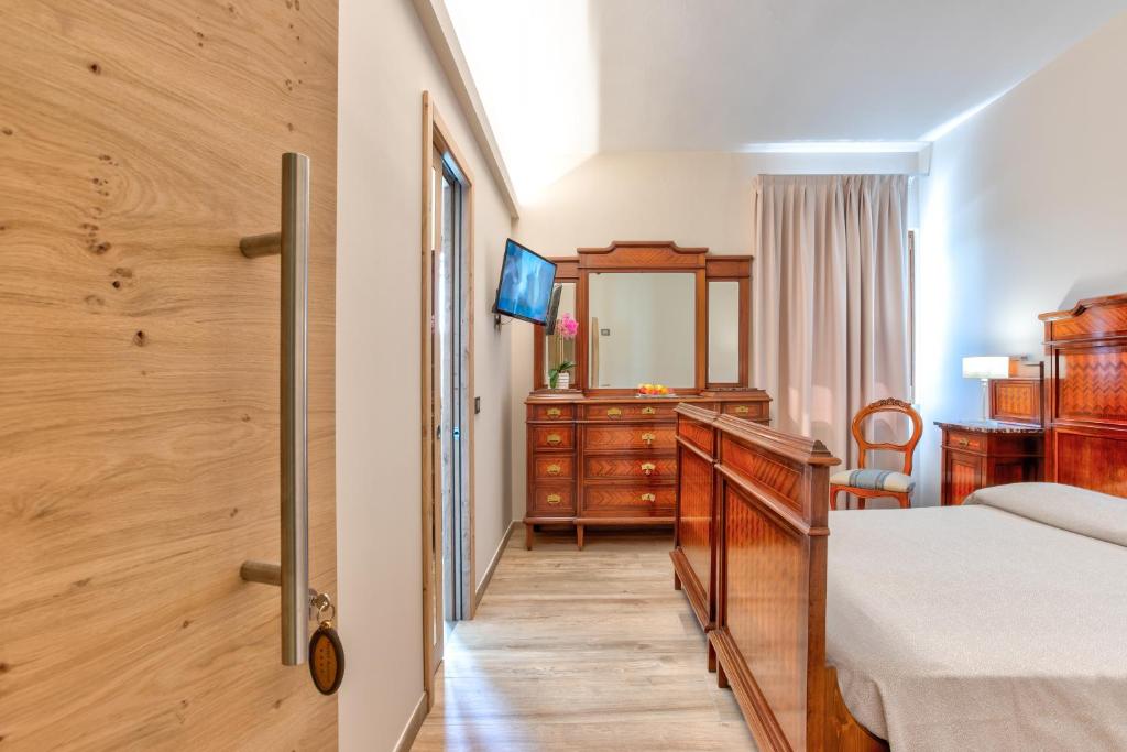 Postel nebo postele na pokoji v ubytování Hotel Aurora