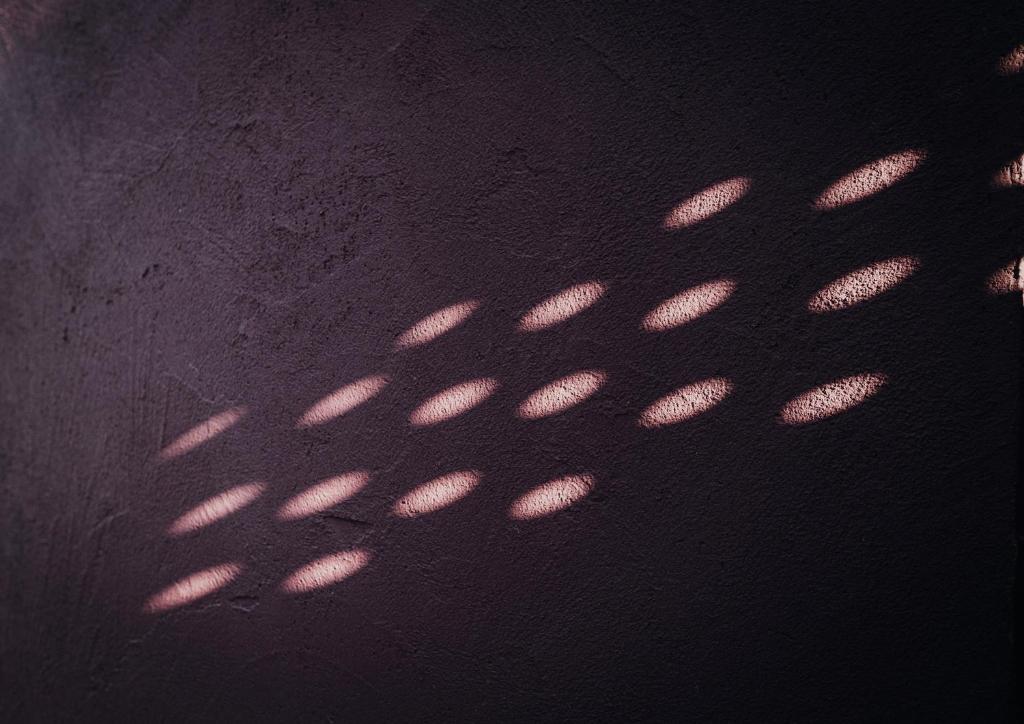 a shadow of a metal object on the ground at Suite 106 in Vasto