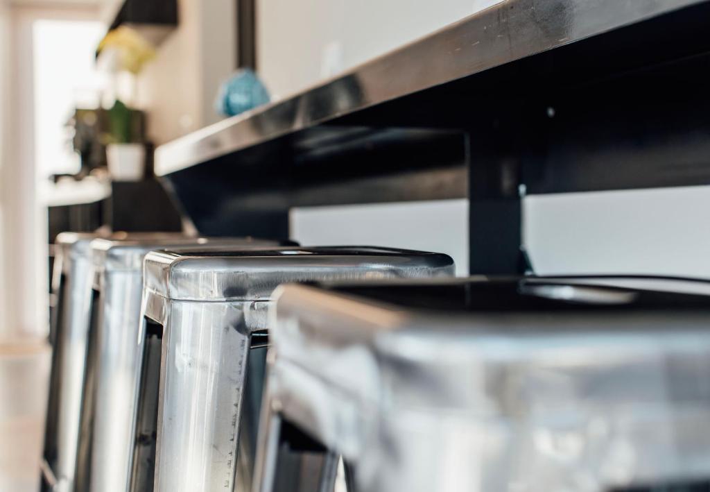 a row of stainless steel appliances in a kitchen at Suite 106 in Vasto
