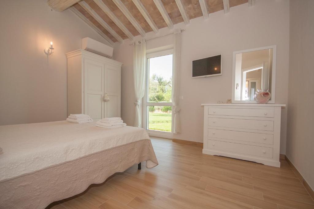 Posteľ alebo postele v izbe v ubytovaní Agriturismo Il Mirto