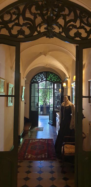 an entry way to a house with a dress on display at La Cordeline in Brignoles