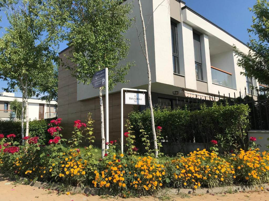 a flower garden in front of a building at Villa Atlantis Homes 2 in Burgas City