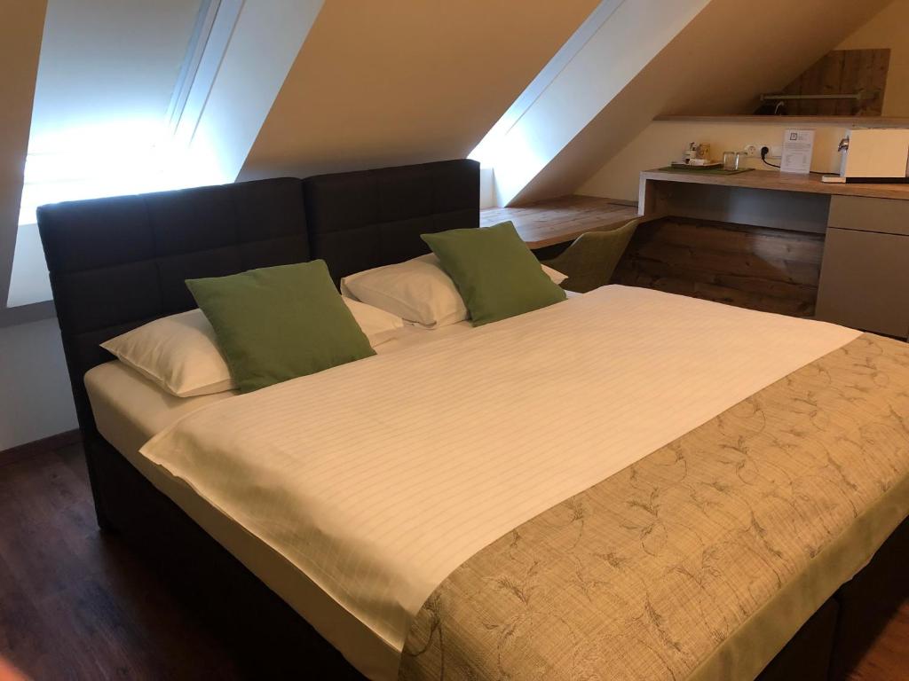 Postel nebo postele na pokoji v ubytování Hotel Braun