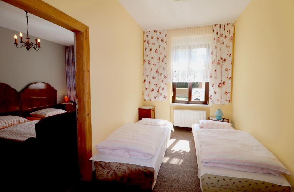 Postel nebo postele na pokoji v ubytování Pension Kuhn