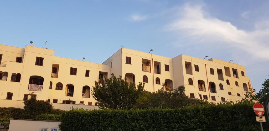 a large building with many windows on the side of it at CATONA HOUSE in Otranto