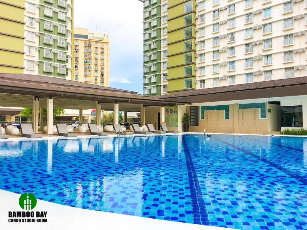 a swimming pool in the middle of a building at Fully Furnished Studio Unit in Mandaue City, Cebu with Fast WiFi and Cable TV in Cebu City
