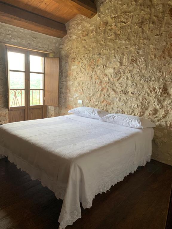 Postel nebo postele na pokoji v ubytování Charme in Perillis