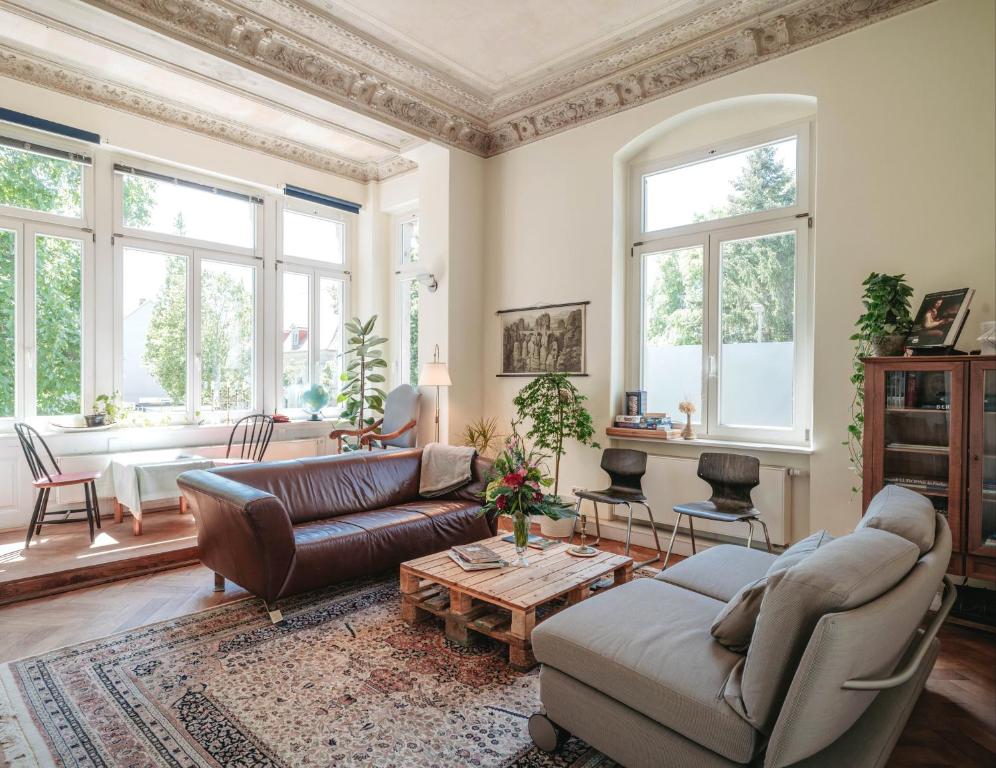 a living room with a couch and a table at Casa Hostel Pirna in Pirna