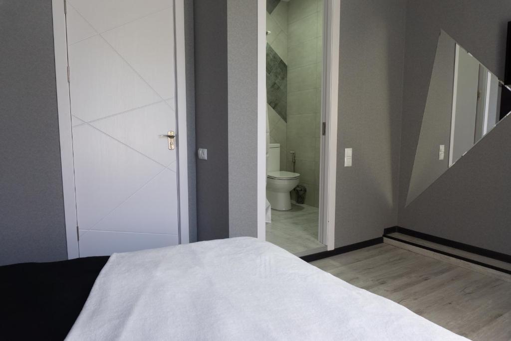 Postel nebo postele na pokoji v ubytování Guesthouse Kado