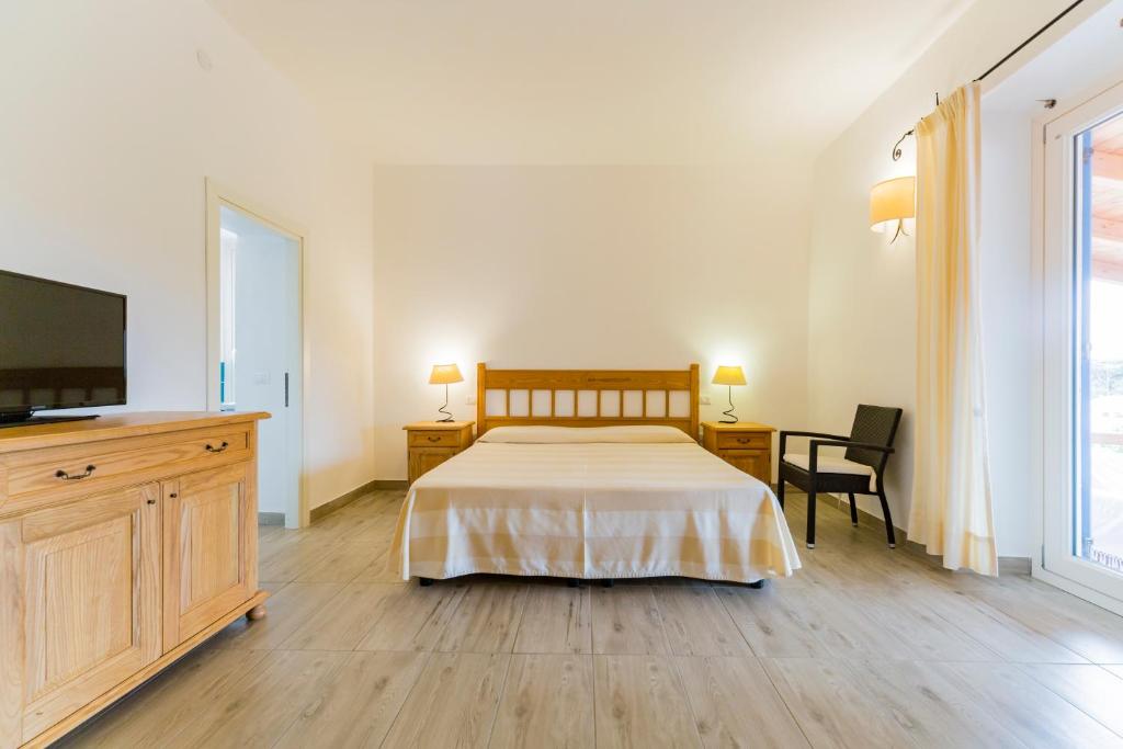 Postel nebo postele na pokoji v ubytování Villa Brigida