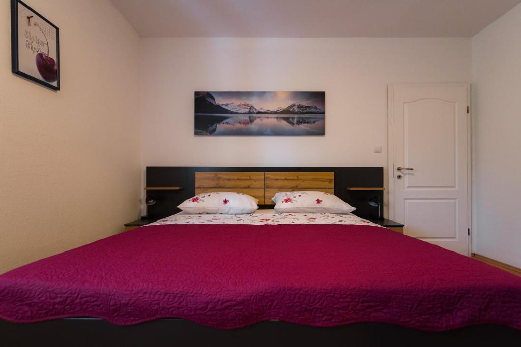 Katil atau katil-katil dalam bilik di Apartments Mira