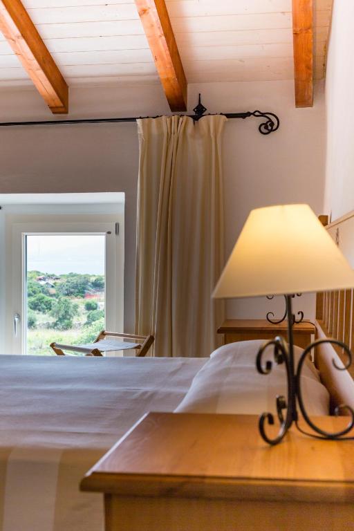 Postel nebo postele na pokoji v ubytování Villa Brigida