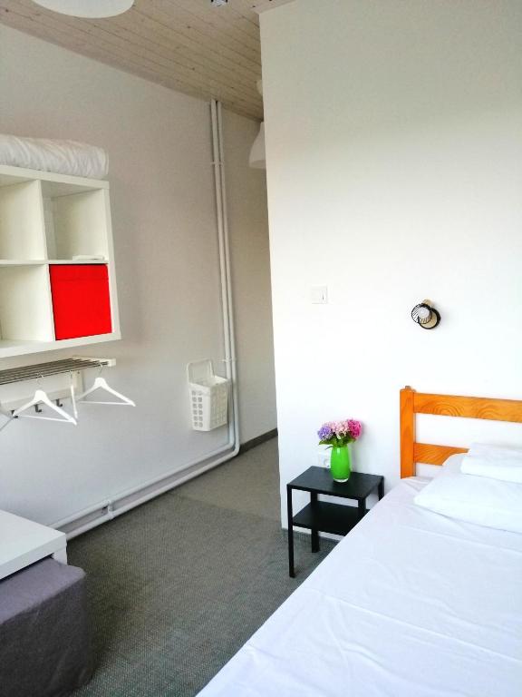 Postel nebo postele na pokoji v ubytování Hostel Dharma