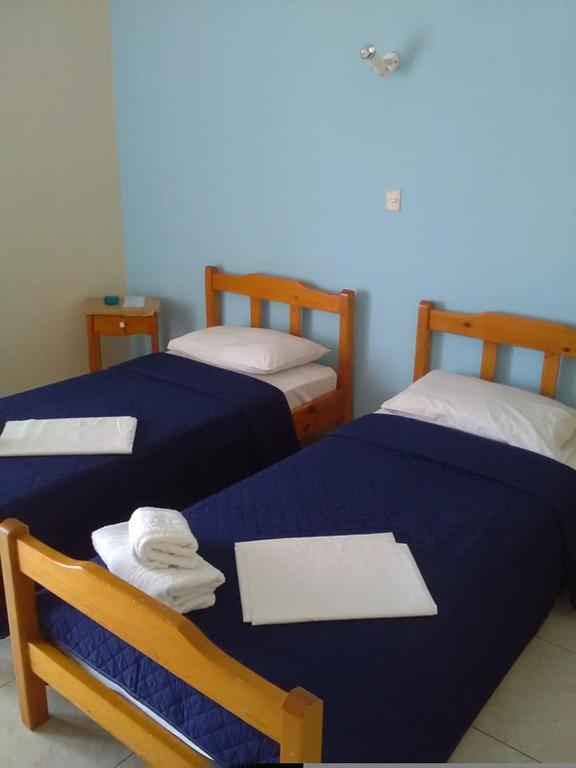 Postel nebo postele na pokoji v ubytování To Giouli