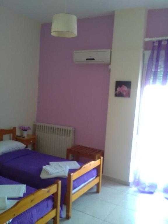 Postel nebo postele na pokoji v ubytování To Giouli